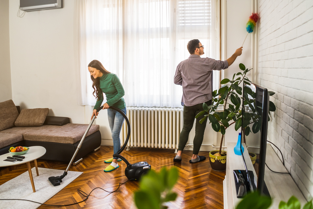 Couple cleaning their home